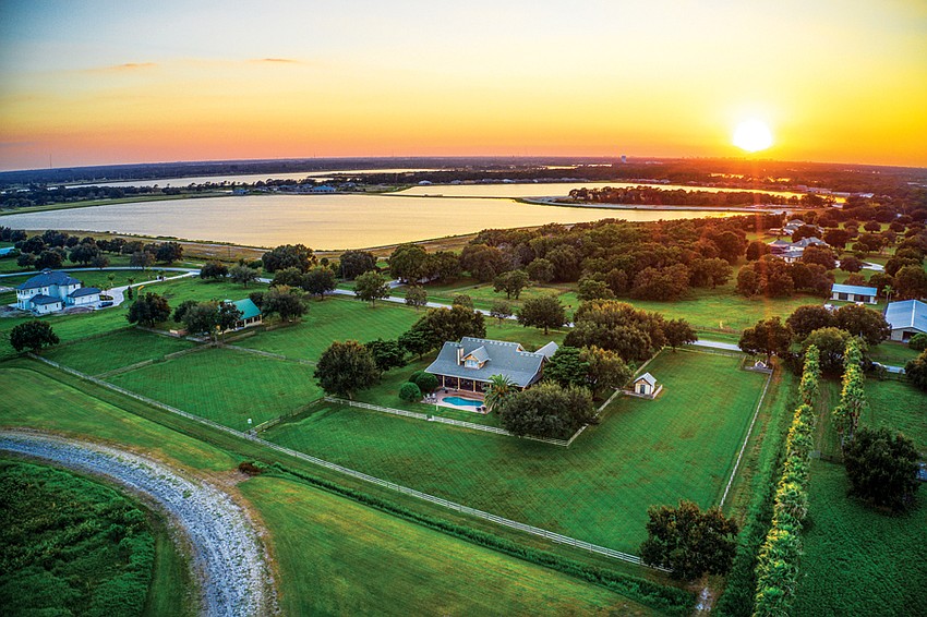 Set on more than 5 acres of land, the Savidge ranch consists of a main house, center, and a barn, to the left. Mature trees surround the home and add to the country atmosphere.