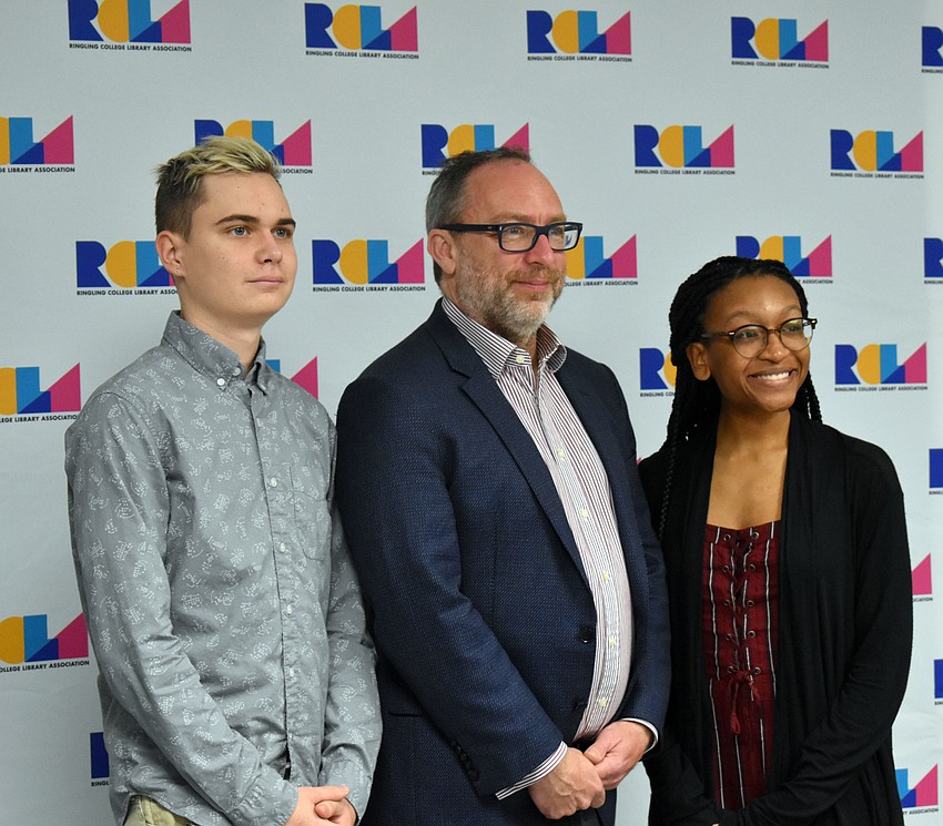 Sarasota Christian School senior Josh Klinger, Jimmy Wales and Booker High School senior Maicy Powell