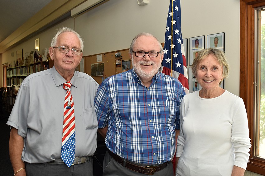 Dale Hooey, the Rev. Michael Durning and Sandy Wood