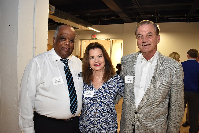 Randall Morgan with Debbie and Bill Partridge