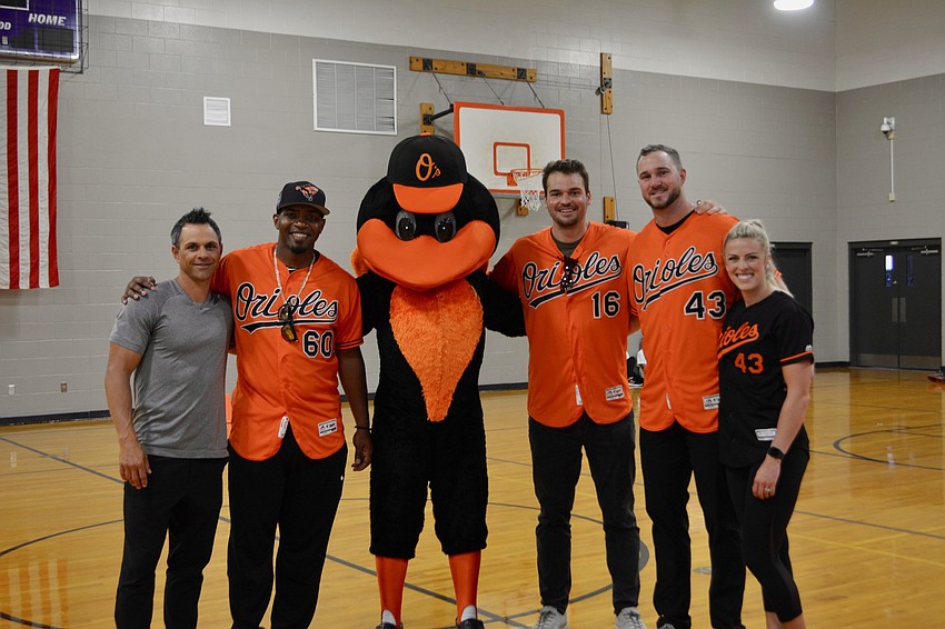 former Orioles second baseman Brian Roberts, Orioles pitcher Mychal Givens, Orioles mascot 