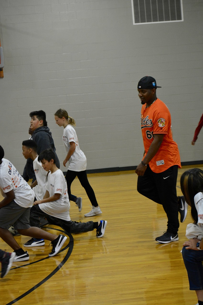 Mychal Givens performed lunges with the team that lost the relay race.