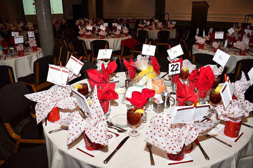 The ballroom was decorated in red and hearts to fit the caring hearts theme.