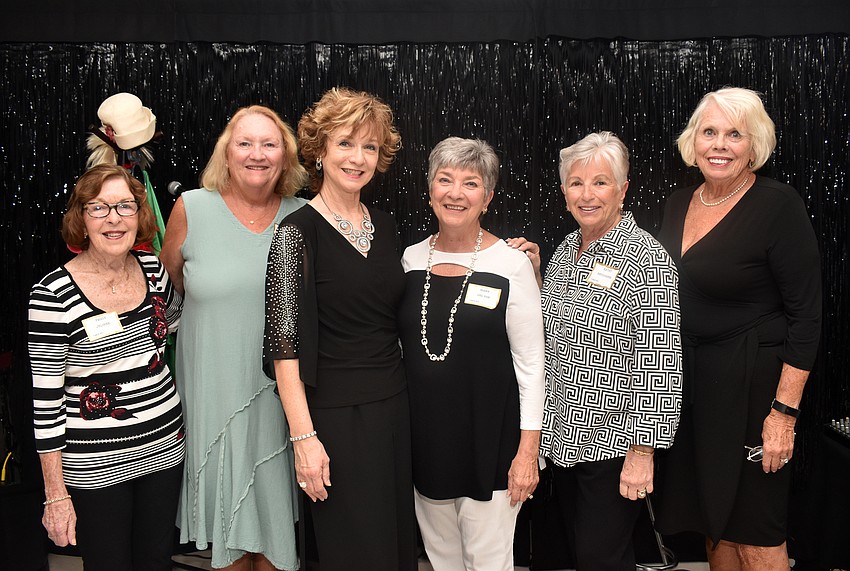 Event committee members Peggy Jelinek, Susan Pariseau, performer Marcy Downey, event committee members Mary Delpup, Kathy Neudorfer and Marge Nuzzo