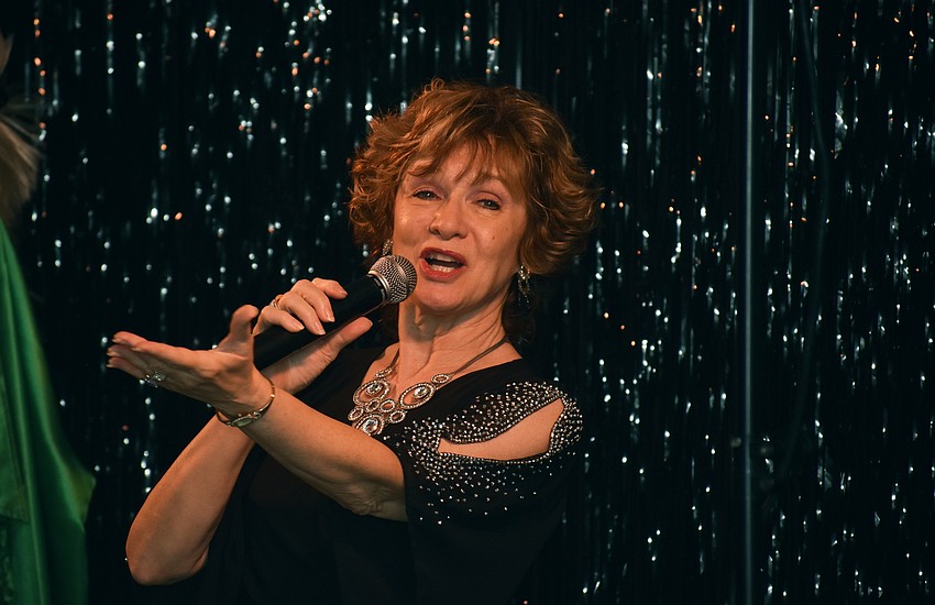 Vocalist Marcy Downey sings “Copacabana” by Barry Manilow.