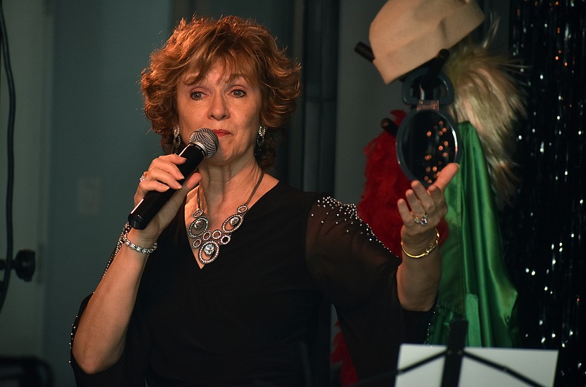 Vocalist Marcy Downey sings “Copacabana” by Barry Manilow.