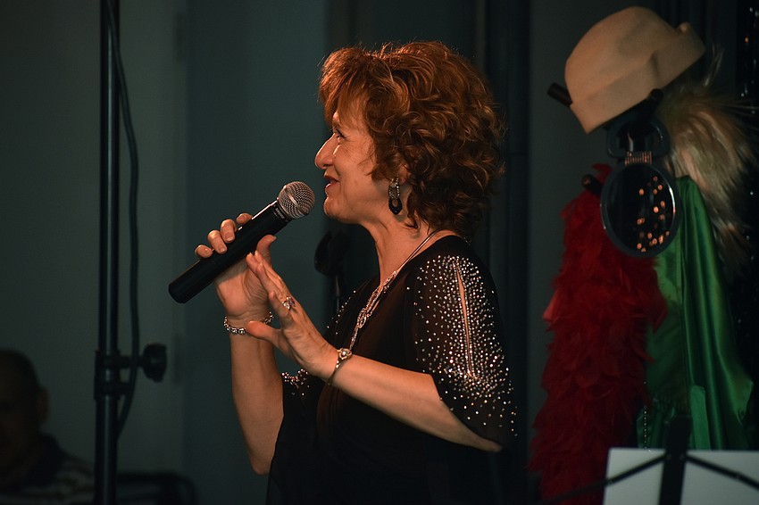 Vocalist Marcy Downey sings “Copacabana” by Barry Manilow.