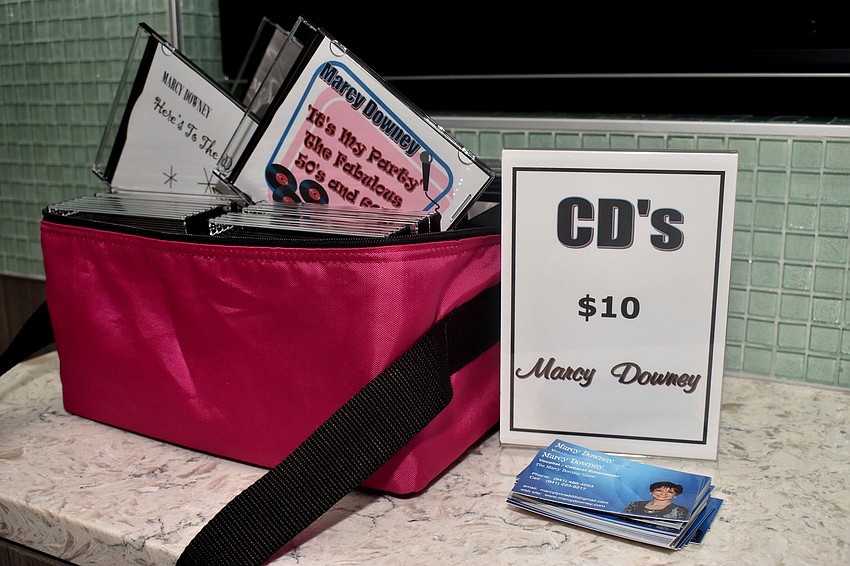 Guests could buy Marcy Downey’s CDs.