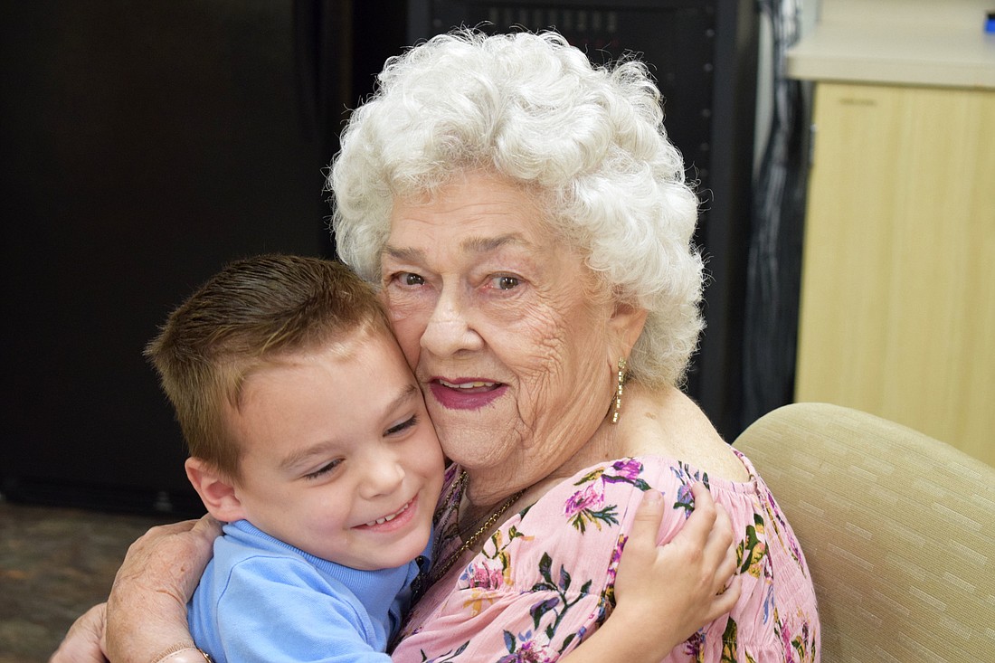 Hilda Hamrick embraces her great grandson, Daniel Meiler, at William H. Bashaw elementary on Thursday, Feb. 21.