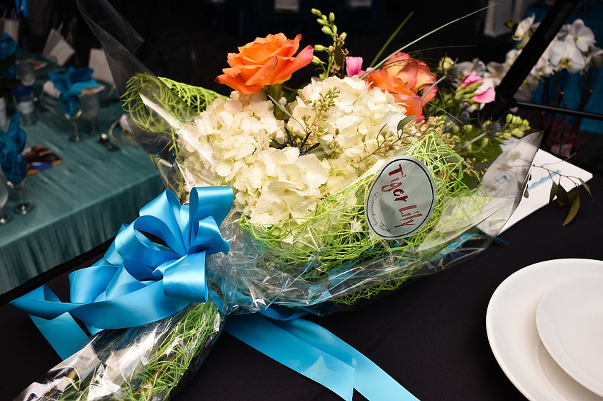 The co-chairwomen were presented with a bouquet from Tiger Lilly.