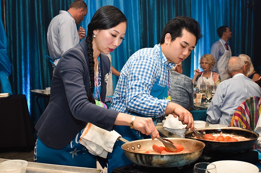 Linda and Andy Doan cook their dish.