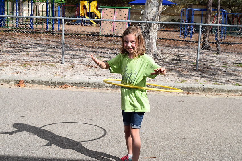 Kalleigh Miller, a first-grader in Tammy Peters' class, hula-hoops her heart out at the Braden River Elementary Walk-A-Thon.