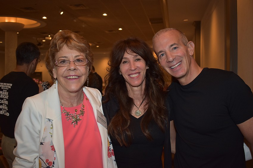 Luncheon Planning Committee member Susan Bergstrom with Andrew Shindler and Rob Shindler, the guest speaker of the night.