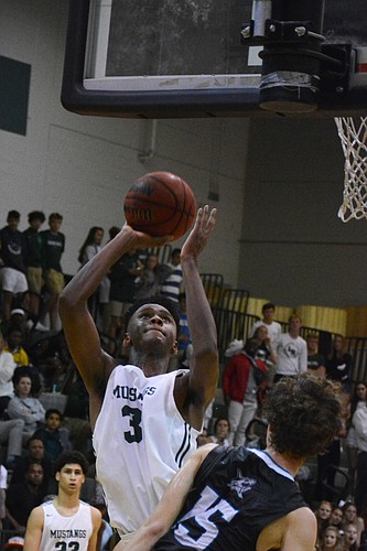 Josh Young rises for a layup against Gulf Coast High.