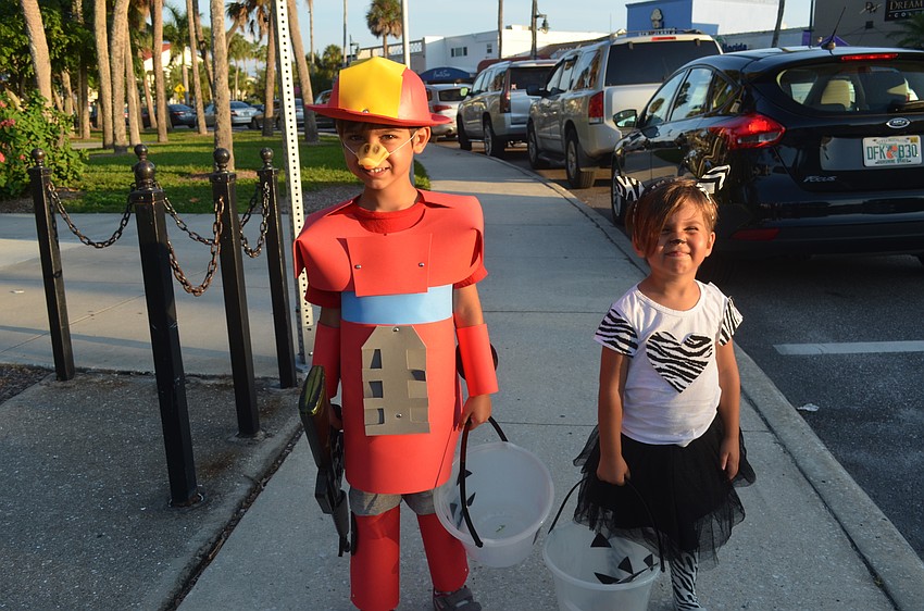 Kai Parks, 4, as Heatwave the Fire-Bot Bird, with sister, Anya, 2, as a zebra