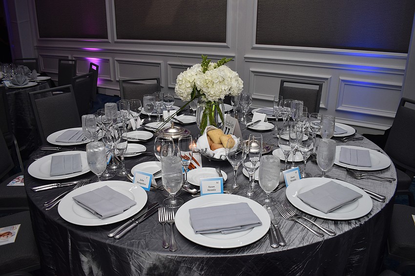 Floral centerpieces topped off the silver tablescapes.
