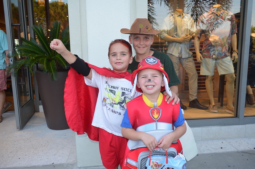 Brooks Trumble, 6, as a superhero, with brothers, Porter, 11, as Chris Kratt, and Kai, 4, as Marshall from Paw Patrol