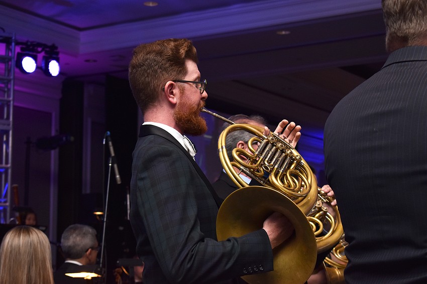 The horn section was the first to play for guests.