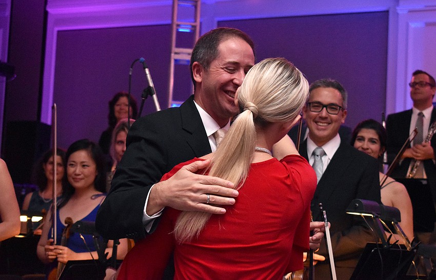 Concertmaster Daniel Jordan embraces Anu Tali at the end of the concert.