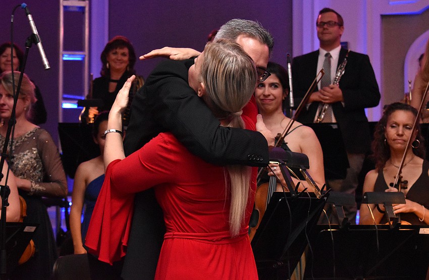 Associate Concertmaster Christopher Takeda gives Anu Tali a hug after the performance.