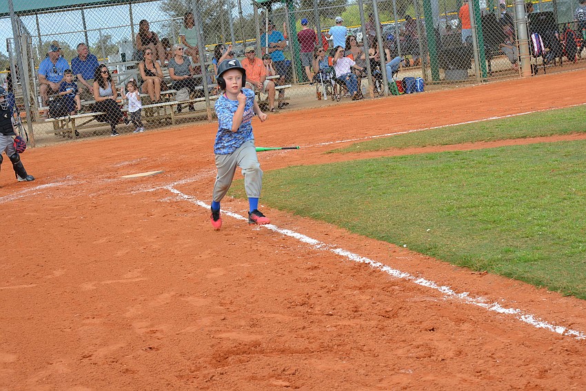 Lakewood Ranch Little League's Ava Guz hits a triple on the first pitch.