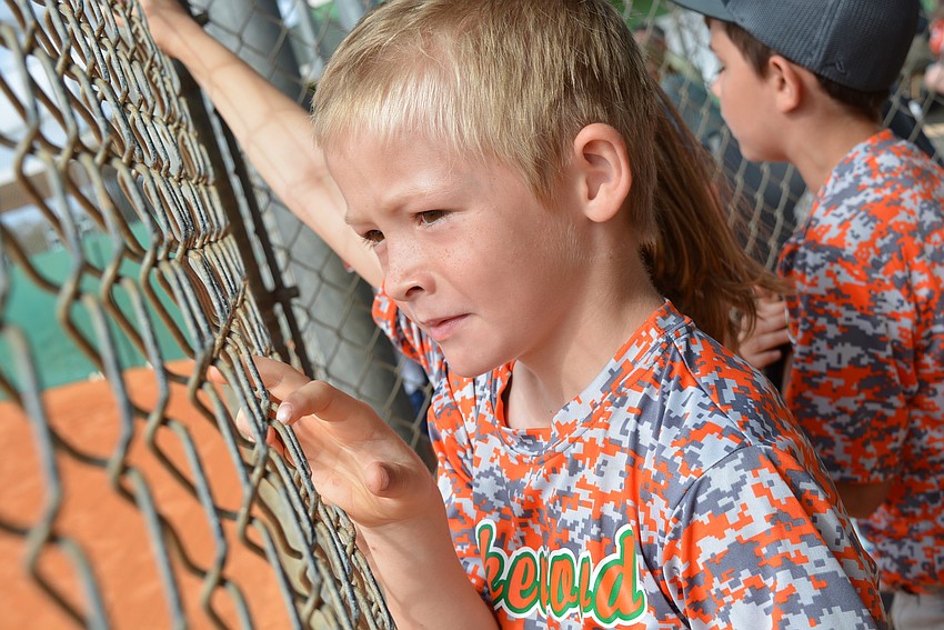 Lakewood Ranch Little League Astros player Hunter Miller watches as teammates try to score in the third inning.