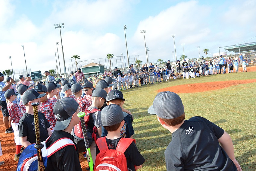 Lakewood Ranch Little League players surround the field as they are introduced to the crowd.