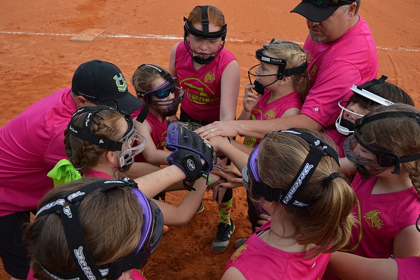 The Southeast Sod Miss Manatee Softball team cheers 