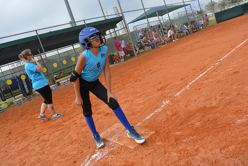 Miss Manatee Softball's Alysa Jones readies to steal a base after making it to first base.