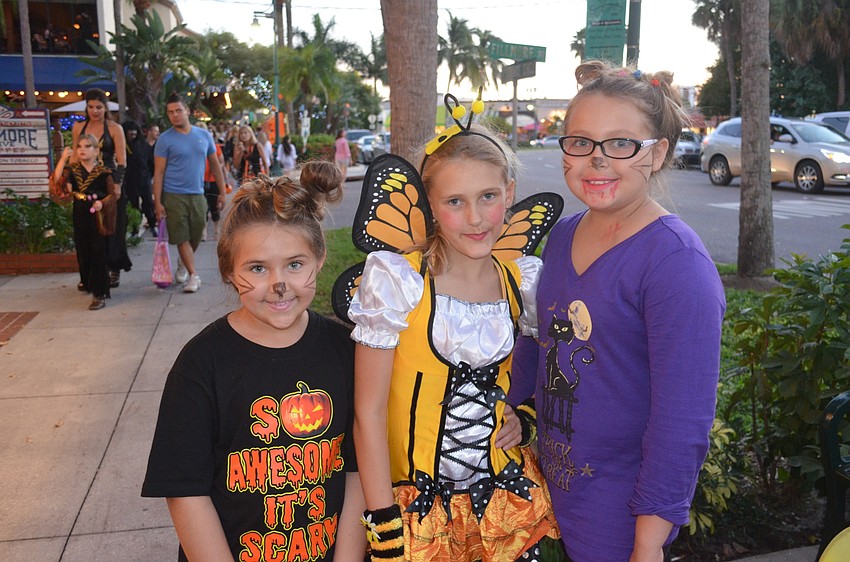 Alessandra Weaver, 9, as a cat, Veda Ziccardi, 10, as a butterfly, and Angelique Adcock, 10, as a cat