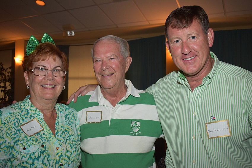 Kathy and Seamus Roche with Father Michael Cannon