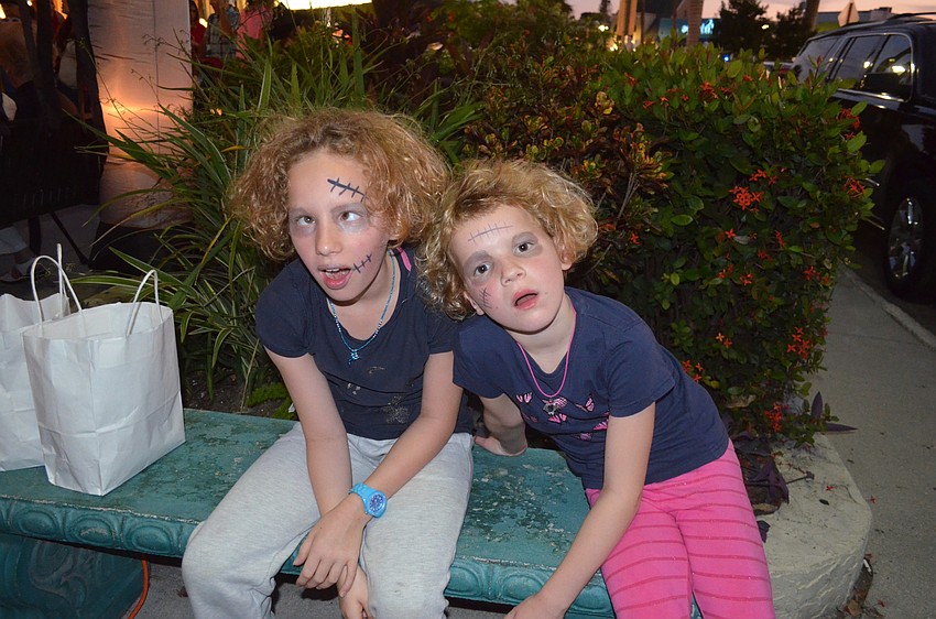 Cecily Bullock, 10, and sister, Maisie, 7, as zombies