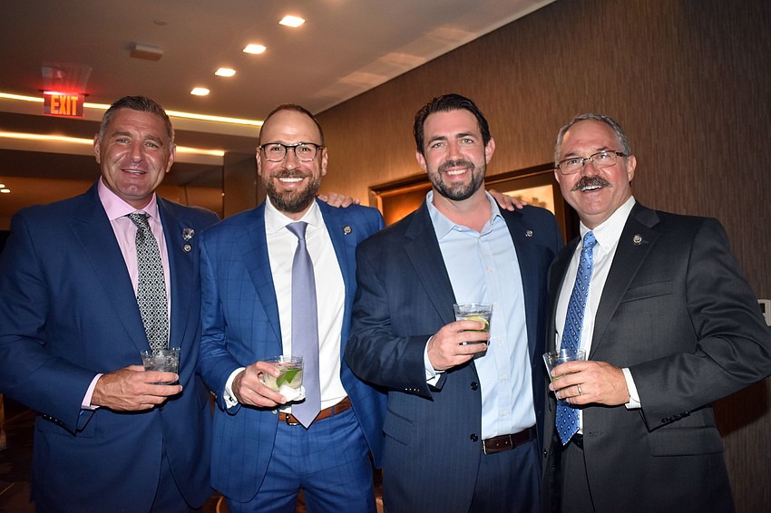 Sarasota Police Foundation board members Michael Evanoff, Stephen Long, Matt McHugh and president Jeff Birnbach