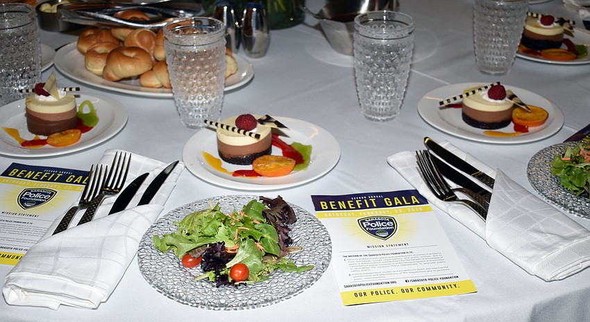 Guests were greeted at their table with a salad and a pamphlet about Sarasota Police Foundation.