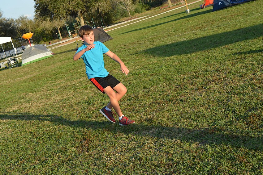 Ten-year-old Country Club East resident Colten Zwizinski plays soccer with friends before it gets dark.