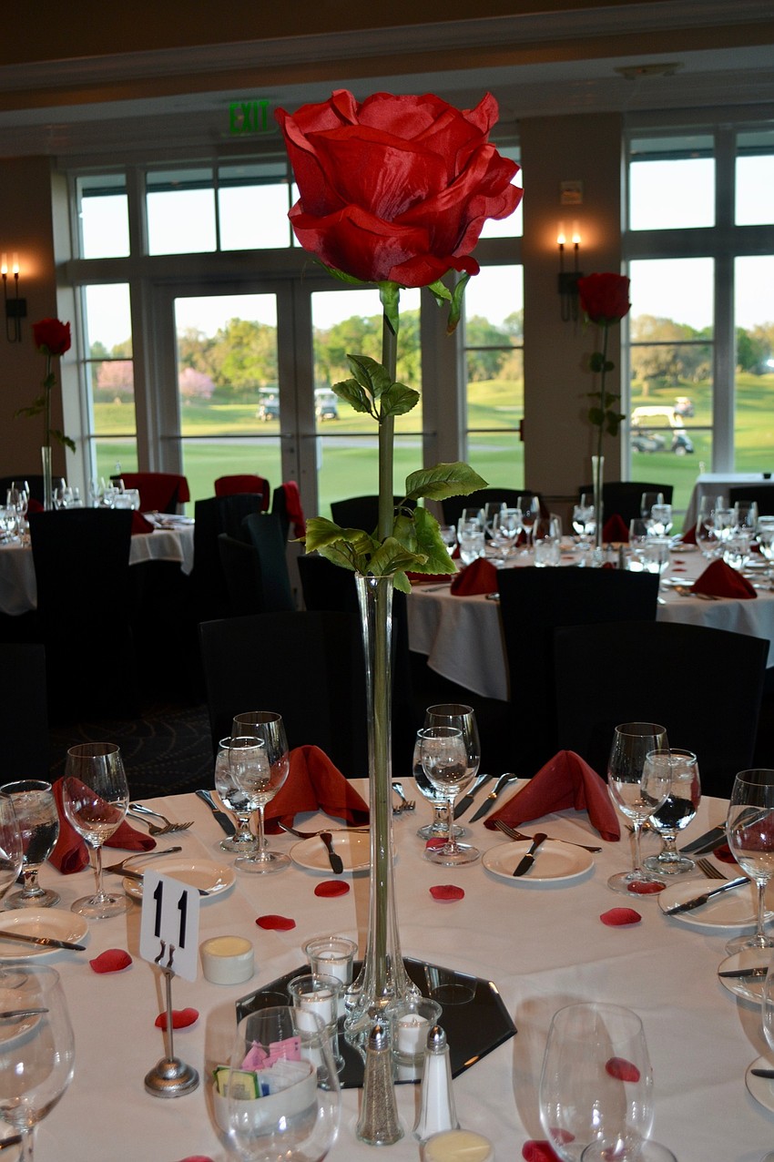 Dinner tables were adorned with rose petals and large rose centerpieces.