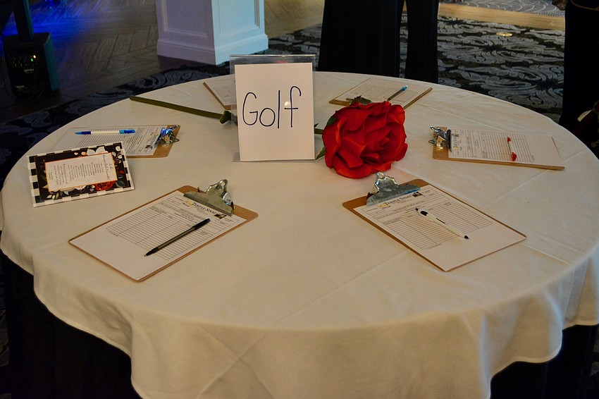 As part of the silent auction, attendees could sign up to bid for time or tickets to restaurants, gold games and more.