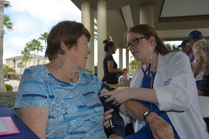 Lakewood Ranch's Mary Ann Seltzer has her blood pressure checked by Dr. Jenna Kazil, who owns Florida Surgical Clinic of Bradenton.