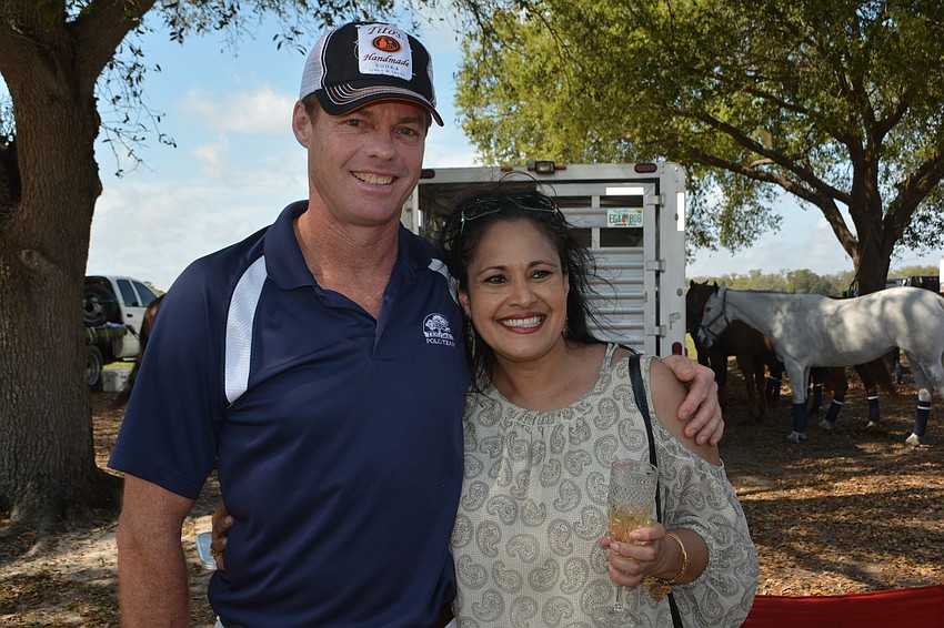 Tito's Stuart Campbell poses with first-time polo fan Suerita Rampertaap of Sarasota before the Observer Cup.