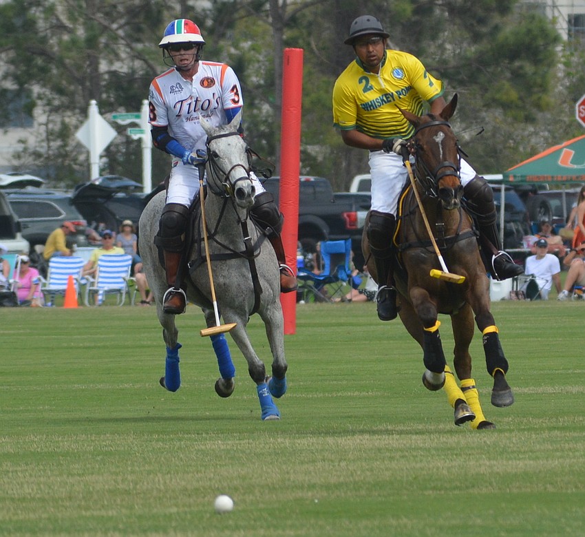Tito's Stuart Campbell races to the ball with Whiskey Pond's Manuel Ontiveros.