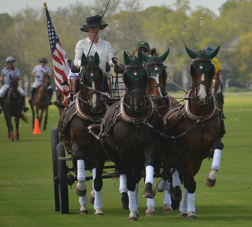 Sarasota Polo Club owner Misdee Miller presents the colors.