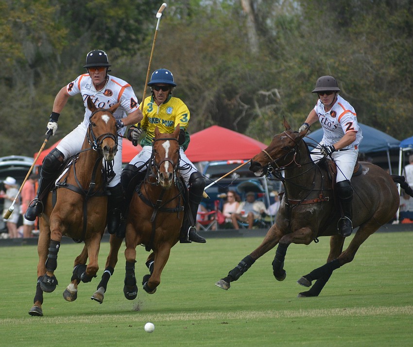 Tito's Joe Wayne Barry leads Whiskey Pond's Charly Quincoses and Tito's James Uihlein in a race to the ball.
