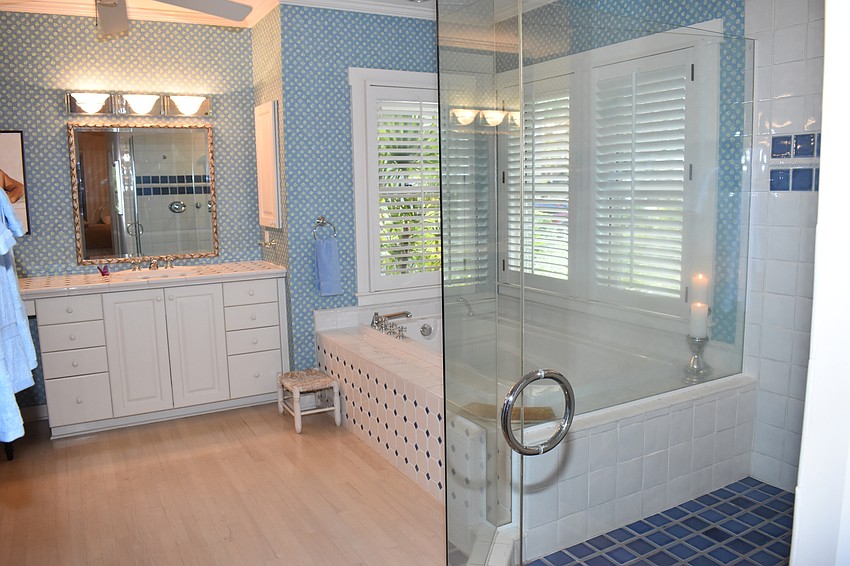 The master bathroom in the Harry Higel house has a large shower and bath.