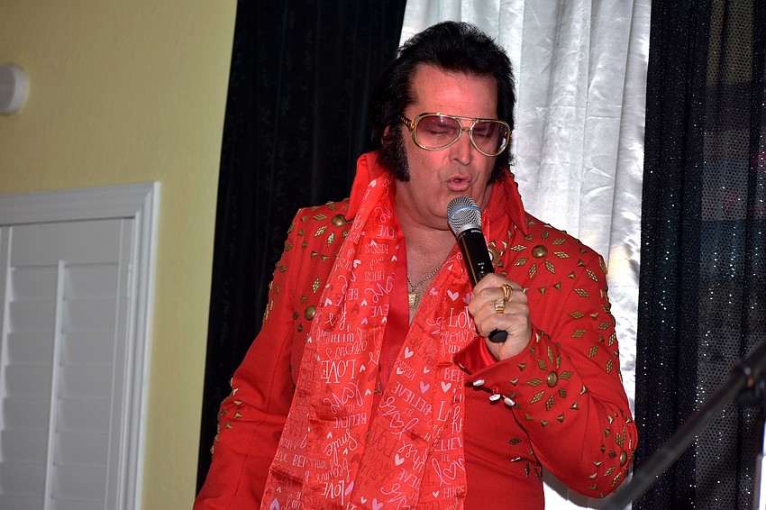 Elvis sings “Burning Love.”