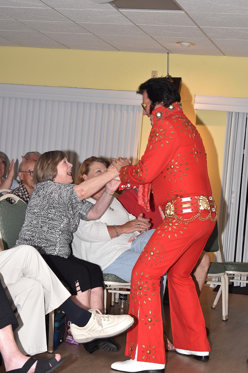 Fans get excited as Elvis makes his appearance.