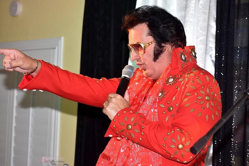 Chris Olsen points to the crowd as he performs.