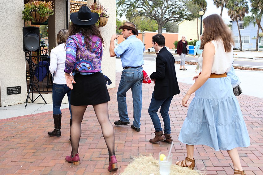 Charles and Dana McCaffrey teach guests how to line dance.