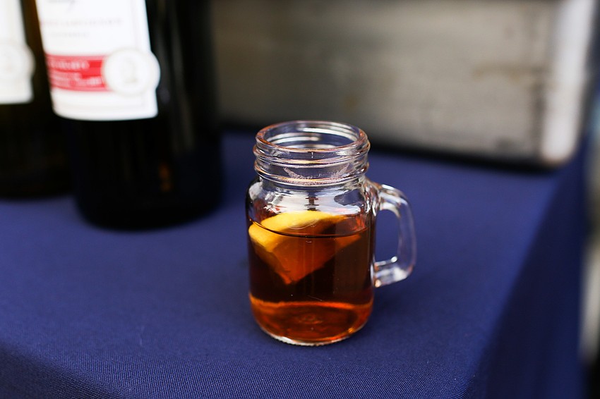 Mini glasses of tea and bourbon were passed around.