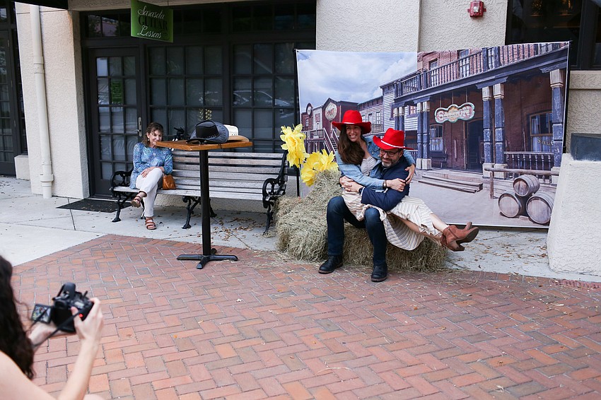 Jason Cannon and Rebecca Harp pose on the step and repeat.