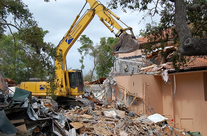 Workers with Forristall Enterprises Inc. are tearing down the Amore building. It&#39;s expected to last about six to eight weeks.